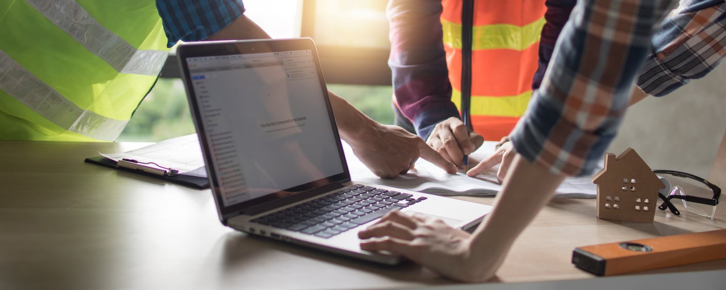 Engineer and Workers Planning for Building Construction